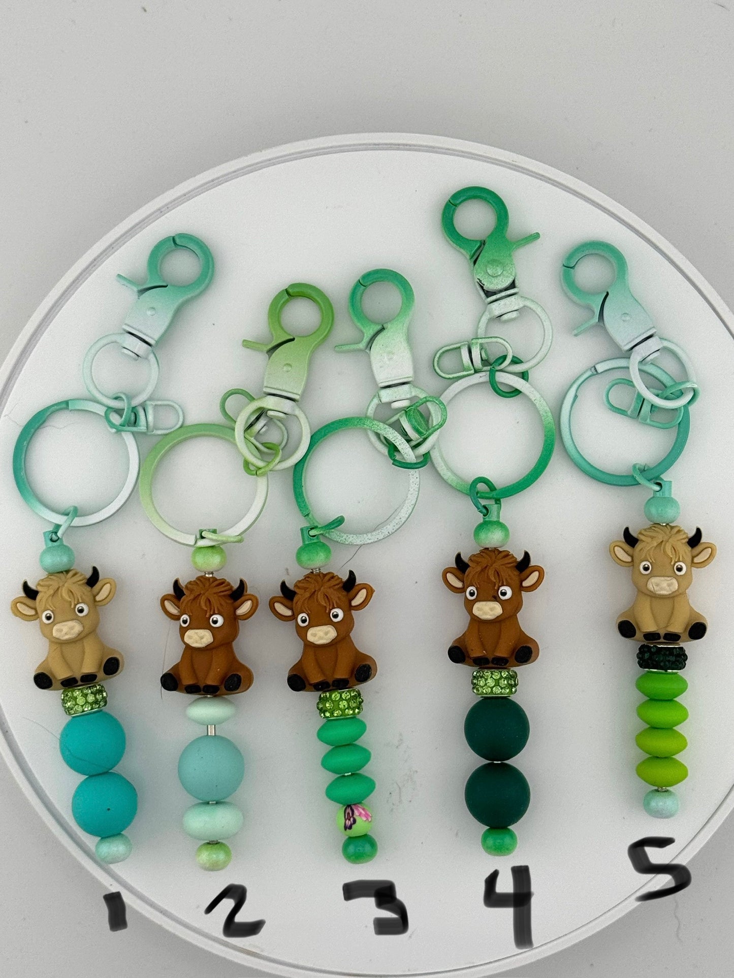 Playful 3D Cows on Green keychains